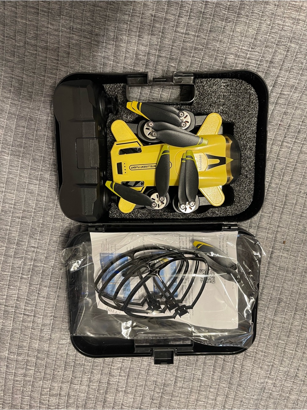 Compact Yellow Foldable Mini Drone with Remote Control and Carry Case
